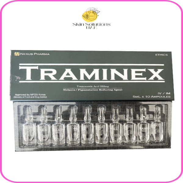 A box of Traminex, containing 10 vials of Tranexamic Acid for skin whitening. The packaging is black with the product name prominently displayed.